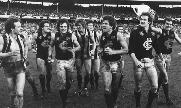 Carlton premiership wingman Michael Young, pictured here between Harmes and Johnston wearing the guernsey of his vanquished Collingwood opponent late on Grand Final day in 1979, has passed away after a long illness. - Carlton,Carlton Blues,AFL